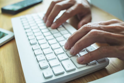 Close-up of hand using mobile phone