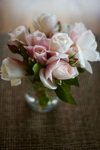 Close-up of pink roses on table