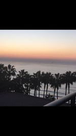 Scenic view of beach against sky during sunset