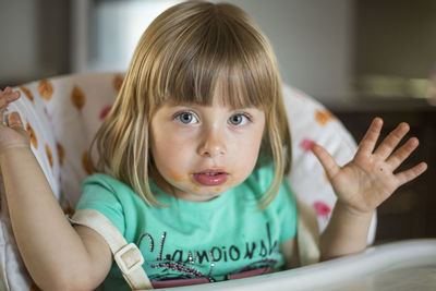 Close-up portrait of girl at home