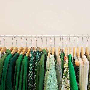 Close-up of clothing hanging on rack at store