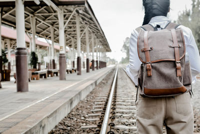 Rear view of woman at railway station platform