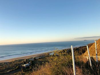 Scenic view of sea against clear blue sky