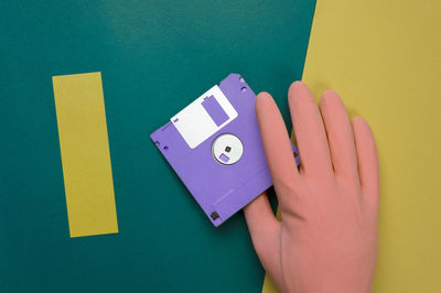 Close-up of human hand holding paper