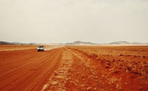 Car on road along desert