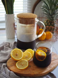 Close-up of coffee and lemon breakfast on table. 