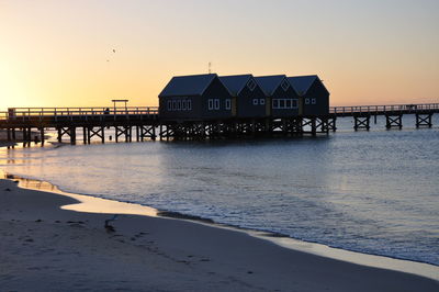 Scenic view of sea against clear sky at sunset