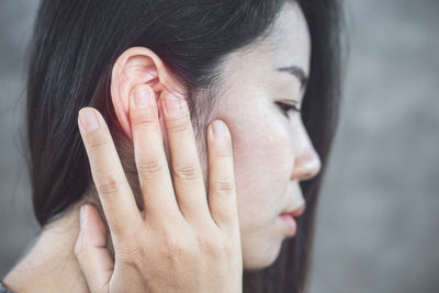 Close-up of a woman with eyes closed