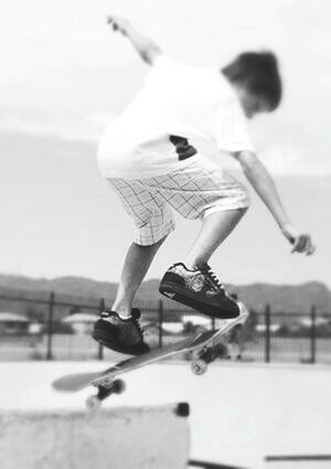 lifestyles, full length, leisure activity, focus on foreground, mid-air, motion, men, side view, on the move, transportation, skill, holding, street, skateboard, selective focus, rear view, person, blurred motion