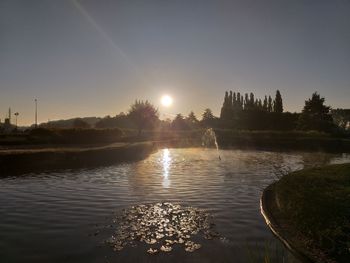 Scenic view of lake against sky during sunset