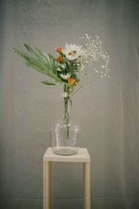 Close-up of white flower vase on table