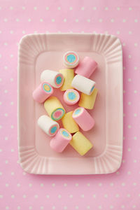 High angle view of multi colored candies on table