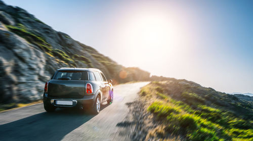 Car on road against mountain range