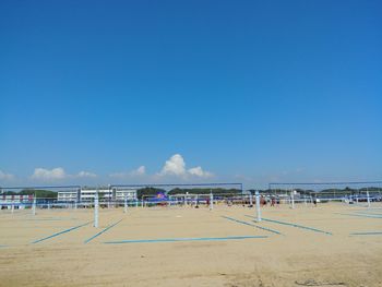 Scenic view of beach against clear blue sky