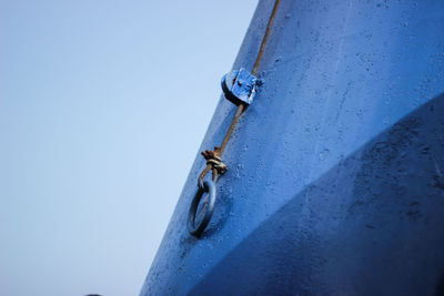 Low angle view of metallic structure against clear blue sky