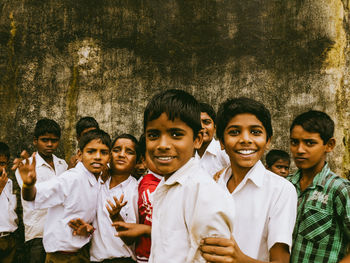 Portrait of happy boy standing outdoors