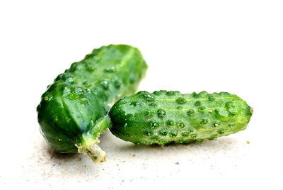 Close-up of green pepper against white background