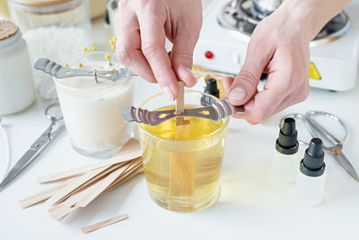 Cropped hands of scientist working on table