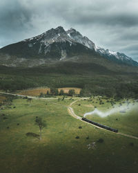 Scenic view of landscape and mountains against sky