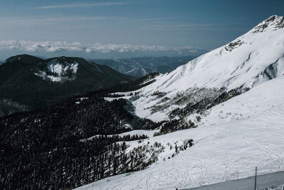 Scenic view of mountains against sky during winter