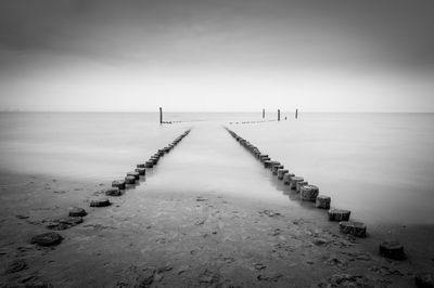 Pier over sea against sky