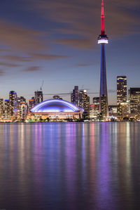 Illuminated city at waterfront