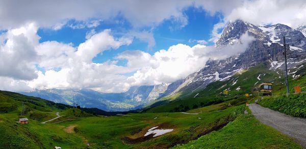 Panoramic view of road amidst mountains against sky