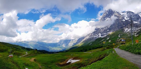 Panoramic view of road amidst mountains against sky