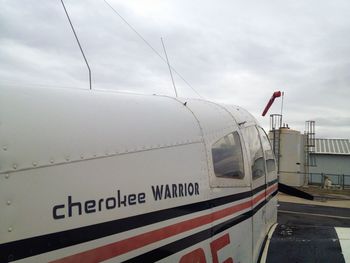 Close-up of airplane against sky