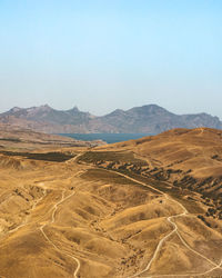 Scenic view of desert against clear sky