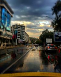 City street against cloudy sky