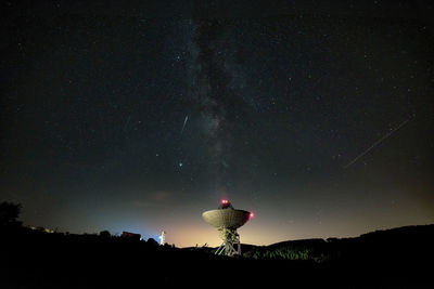 Low angle view of star field against sky at night