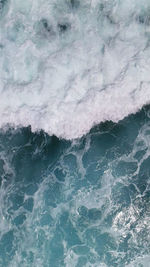 Full frame shot of waves rushing towards shore