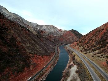 Panoramic view of road amidst mountains against sky