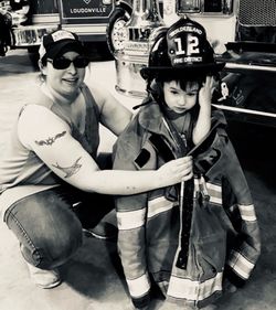 Portrait of smiling boy holding camera