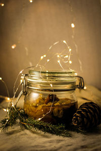 Close-up of tea light candles on table