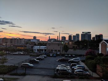 High angle view of city street against sky during sunset