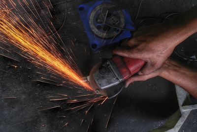 Midsection of man working in factory