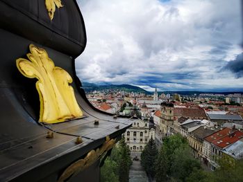 Panoramic view of buildings in city against sky