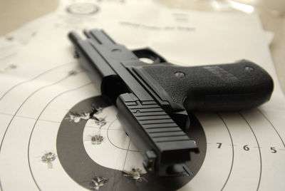Close-up of gun on sports target