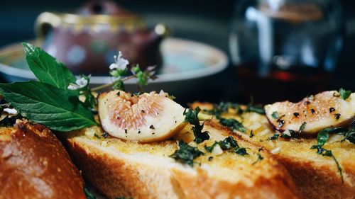 Close-up of fig on bread