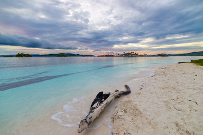 Scenic view of sea against cloudy sky