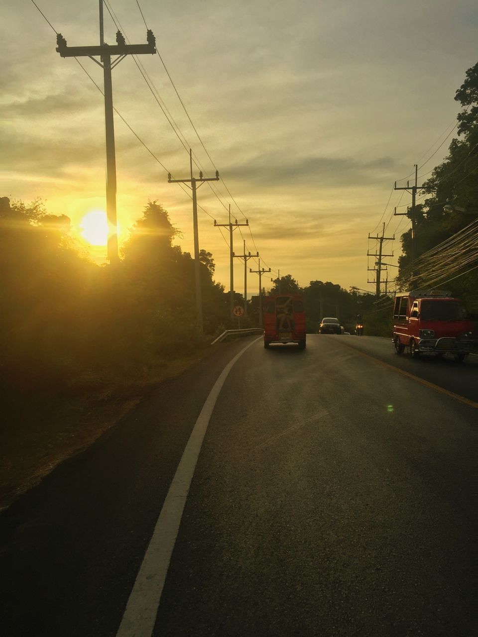 ROAD AGAINST SKY DURING SUNSET