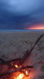 Scenic view of beach against sky during sunset