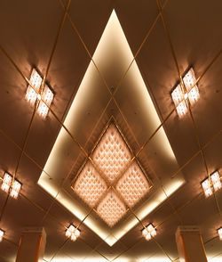 Low angle view of illuminated ceiling