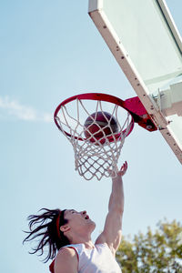 Low angle view of basketball hoop against sky