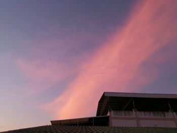 Low angle view of building against sky during sunset