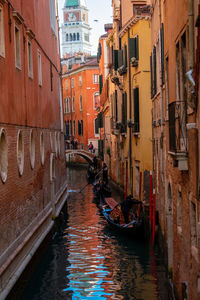 Canal amidst buildings in city