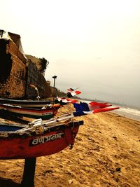 View of boats in sea against clear sky