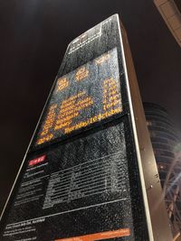 Low angle view of illuminated text at night